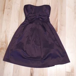 A dark purple strapless dress